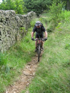 Kev on the singletrack descent to Hayfield campsite. 